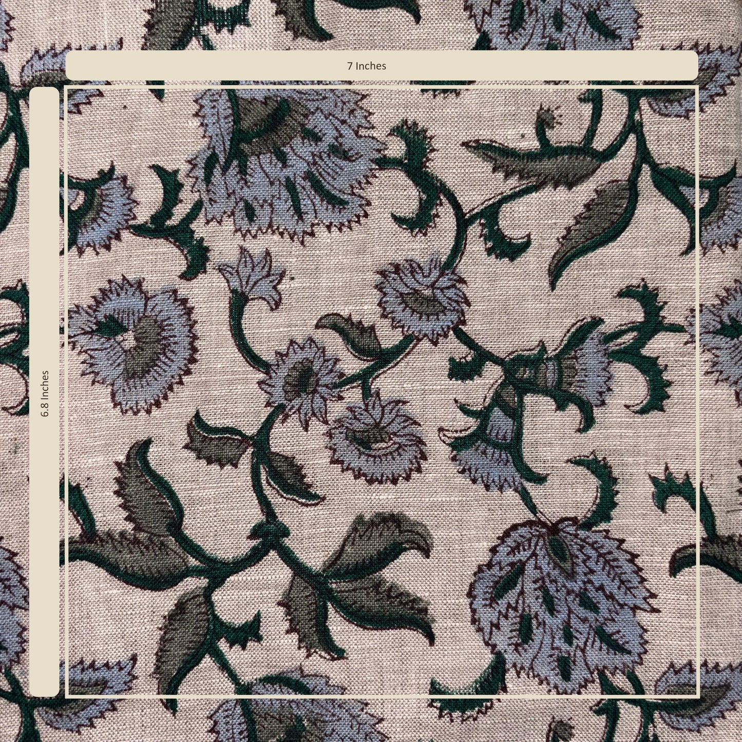 Floral patterned fabric with a ruler for scale on a grey background