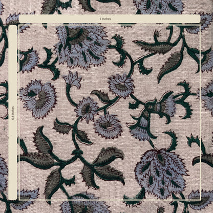 Floral patterned fabric with a ruler for scale on a grey background