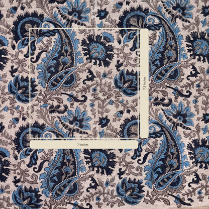 Patterned fabric with blue and black paisley design on a grey background