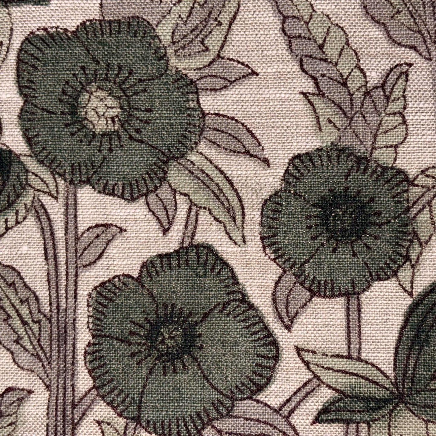 Close-up of a floral pattern with green flowers and leaves on a textured background
