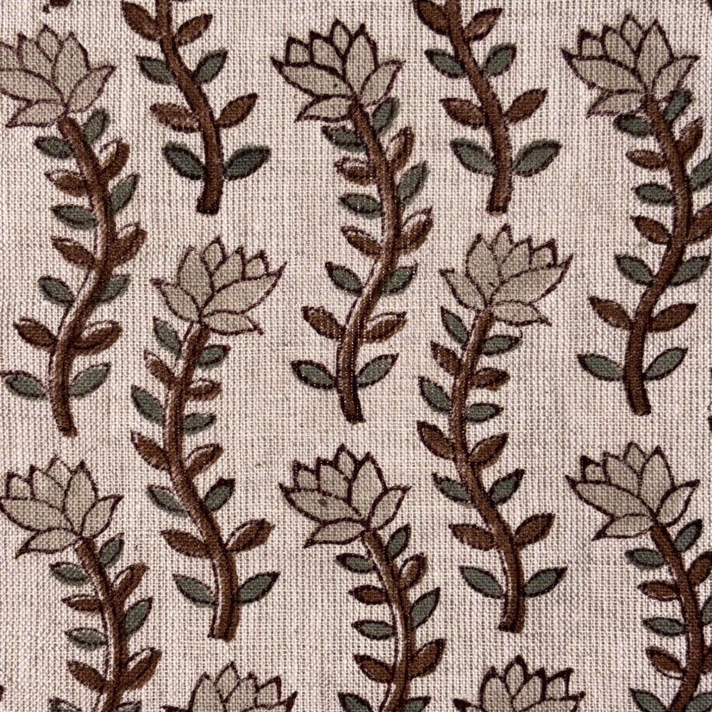 Pattern of stylized leaves and branches on a grey background