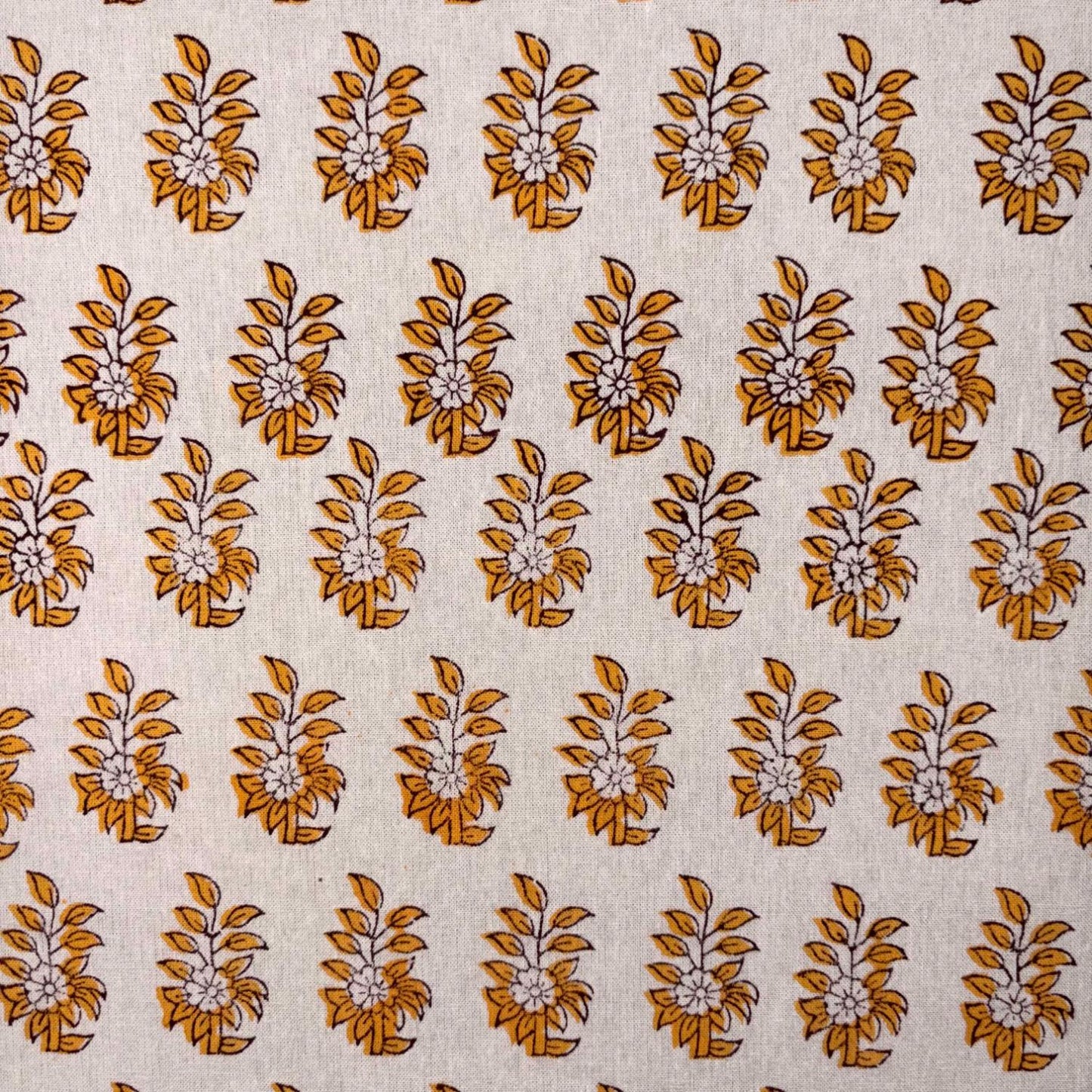 Patterned fabric with brown floral design on a beige background