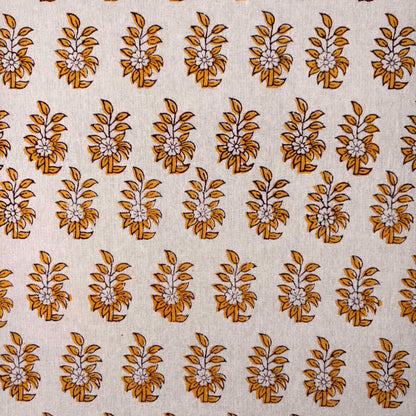 Patterned fabric with brown floral design on a beige background