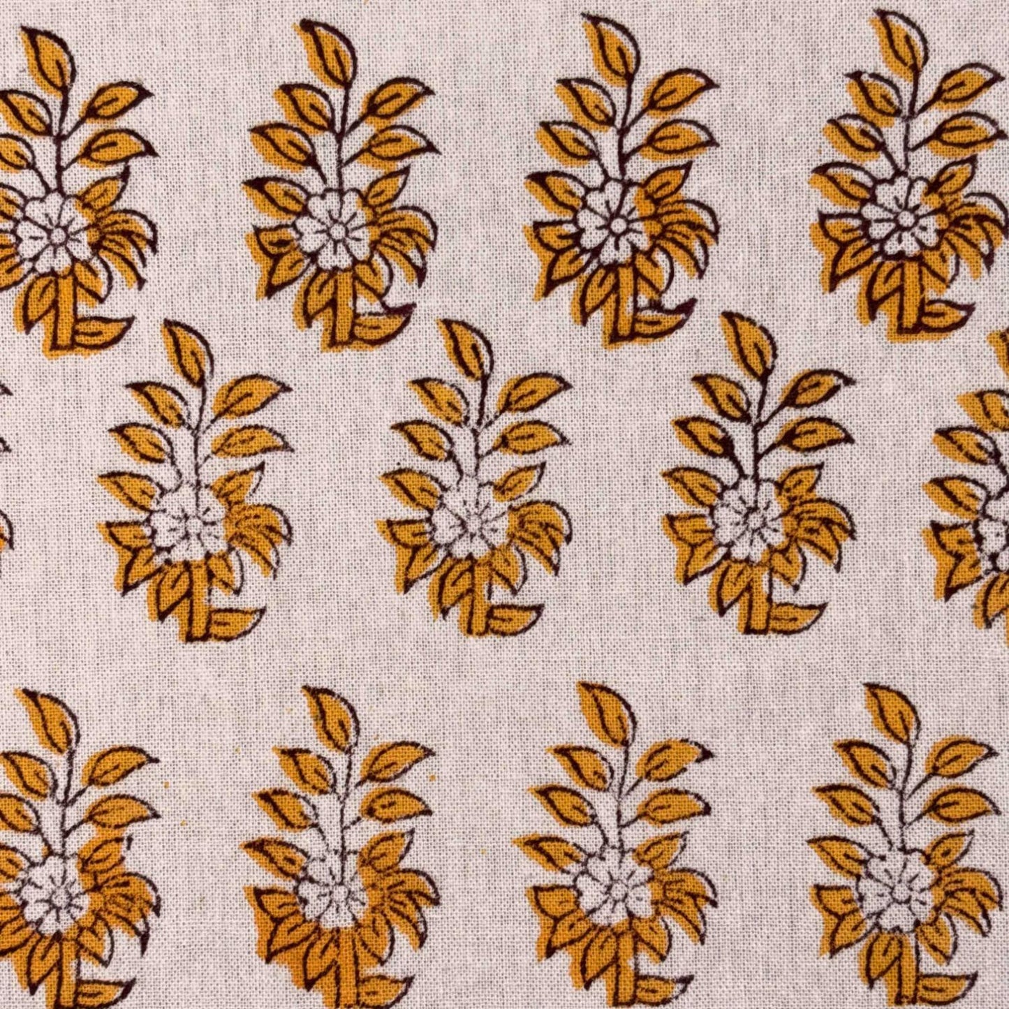 Pattern of yellow floral designs on a beige fabric background