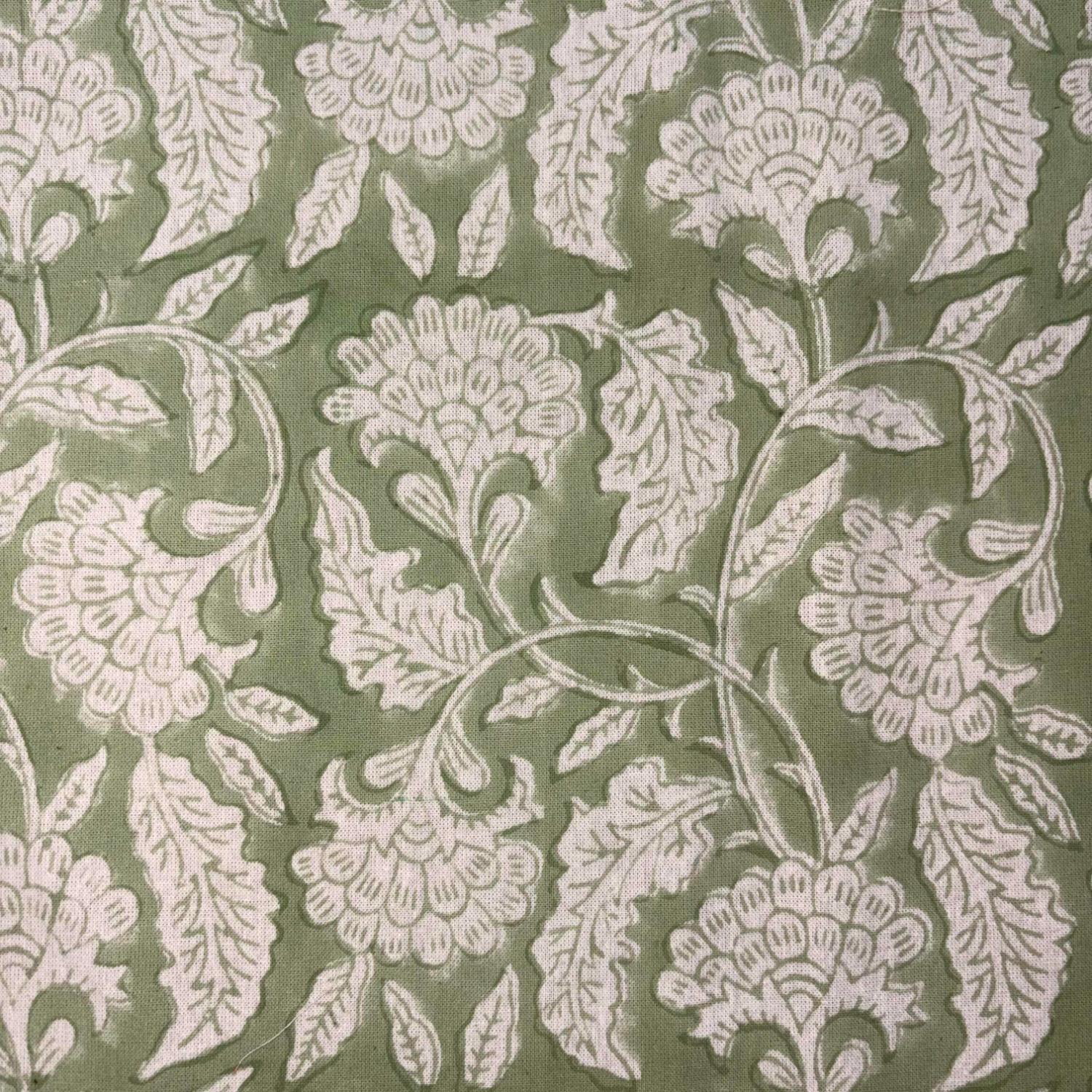 Floral pattern with white flowers and leaves on a green background