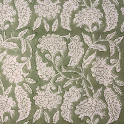 Floral pattern with white flowers and leaves on a green background