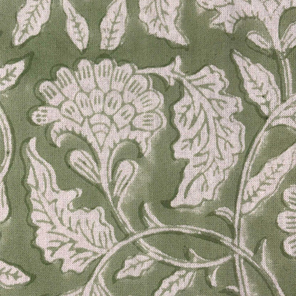 Close-up of a floral pattern with green leaves and white flowers on a green background