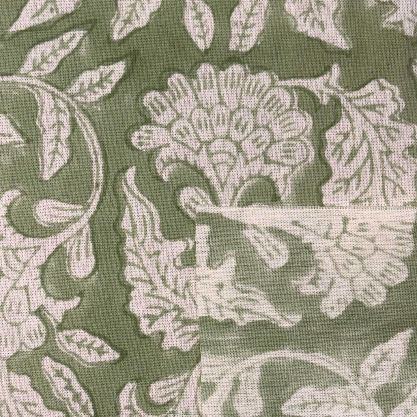 Close-up of floral patterned fabric with green background