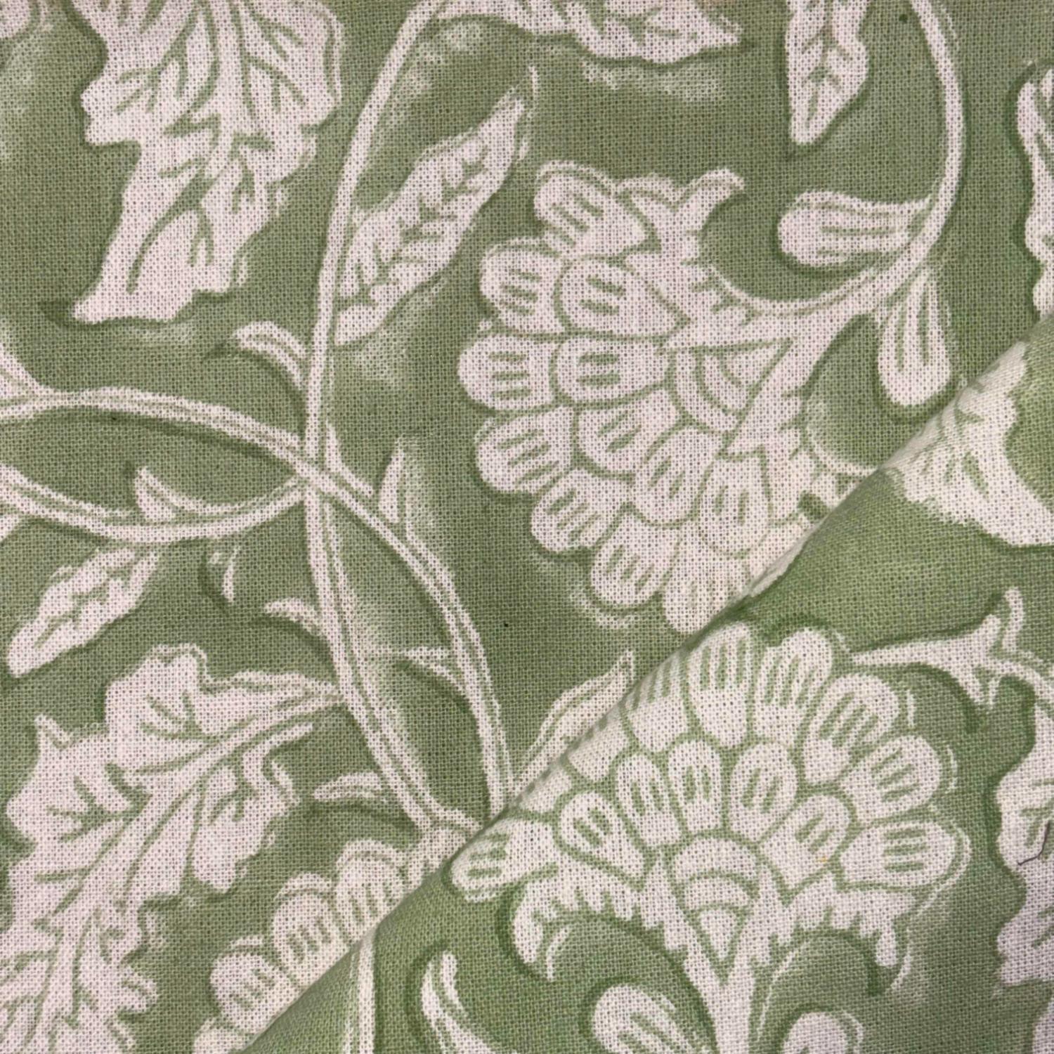 Close-up of floral patterned fabric with green background