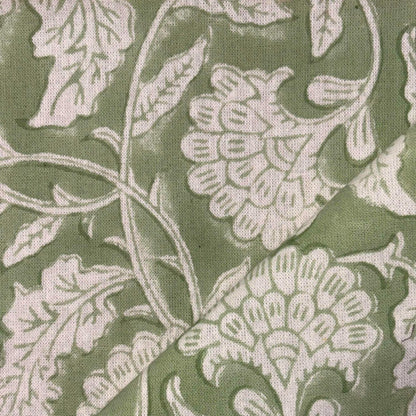 Close-up of floral patterned fabric with green background
