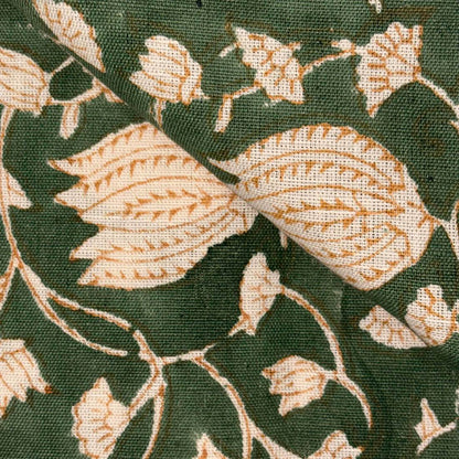 Close-up of floral patterned fabric with green and beige colors