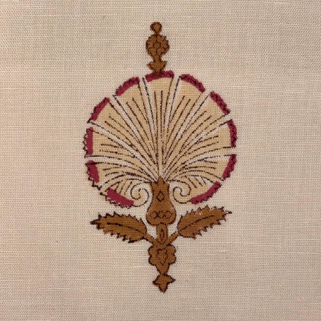 Decorative embroidery design on a beige fabric background
