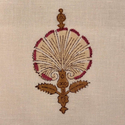 Decorative embroidery design on a beige fabric background