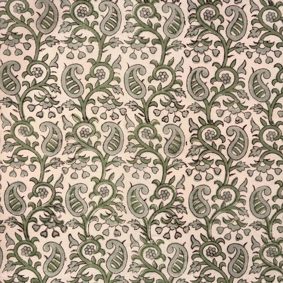 Patterned fabric with green and beige design