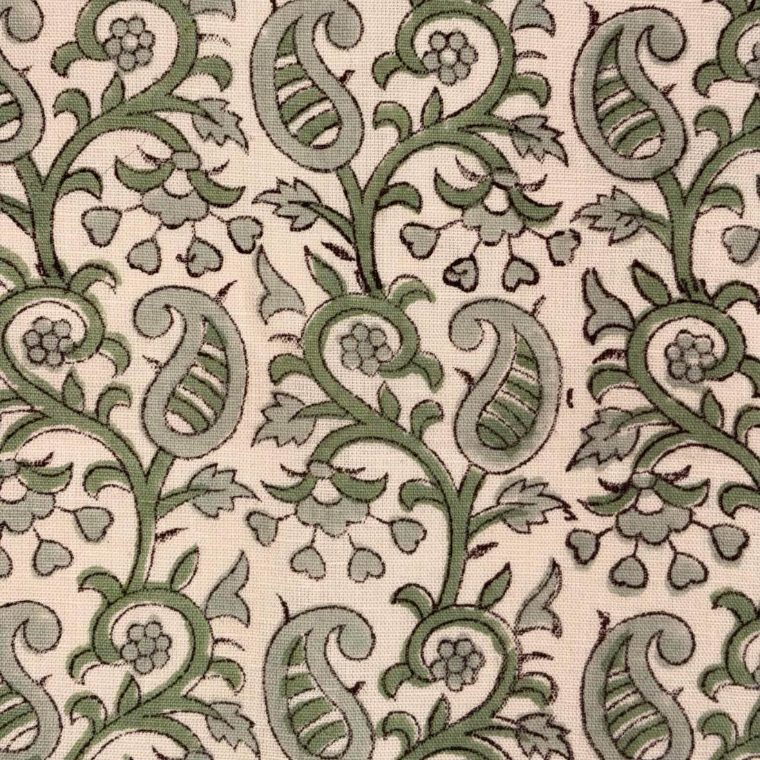 Green paisley pattern on a beige background