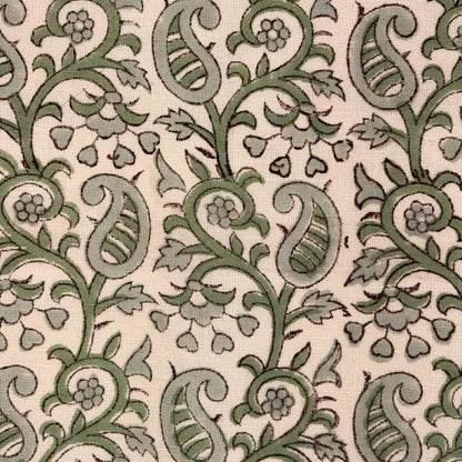 Green paisley pattern on a beige background
