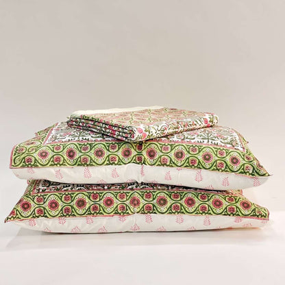 Stack of patterned pillows on a light gray background
