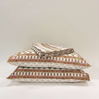 Stack of patterned pillows on a white background