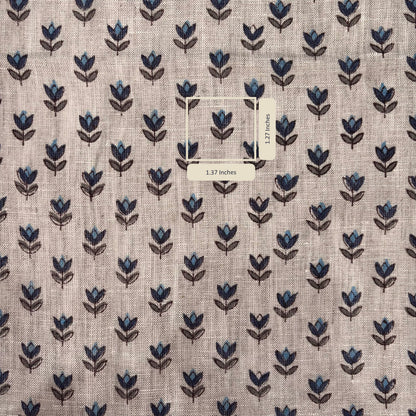 Fabric with blue floral pattern and a label on a grey background