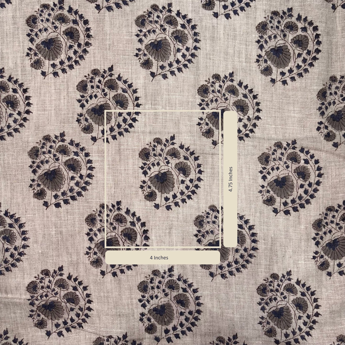 Textile with floral pattern and measurement scale on a beige background