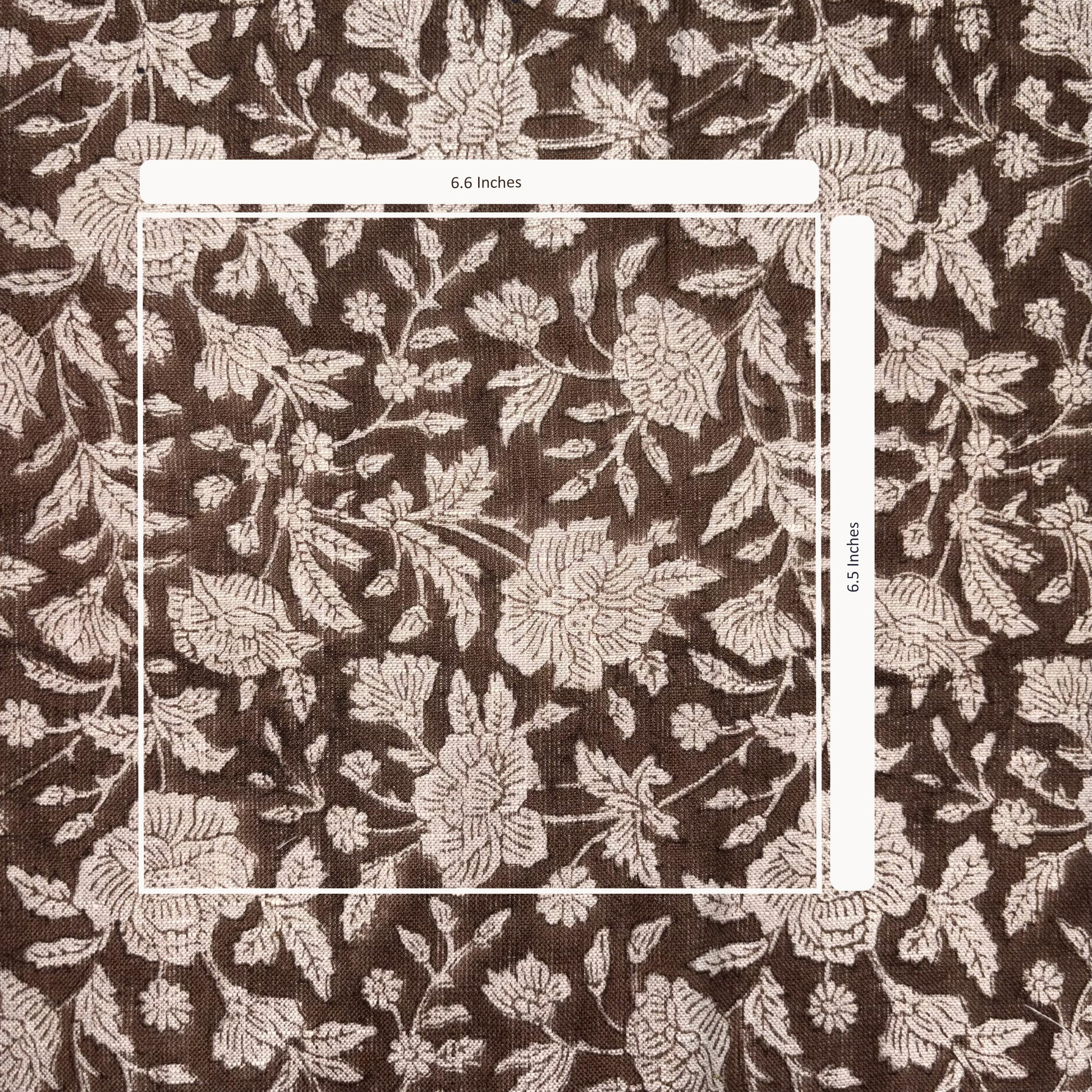 Floral patterned fabric with a measurement overlay on a brown background