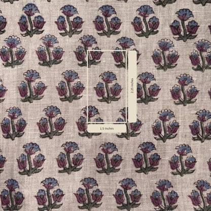 Fabric with floral pattern and measurement label on a beige background