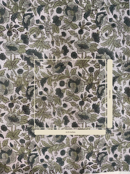 Floral patterned fabric with a ruler for scale on a grey background