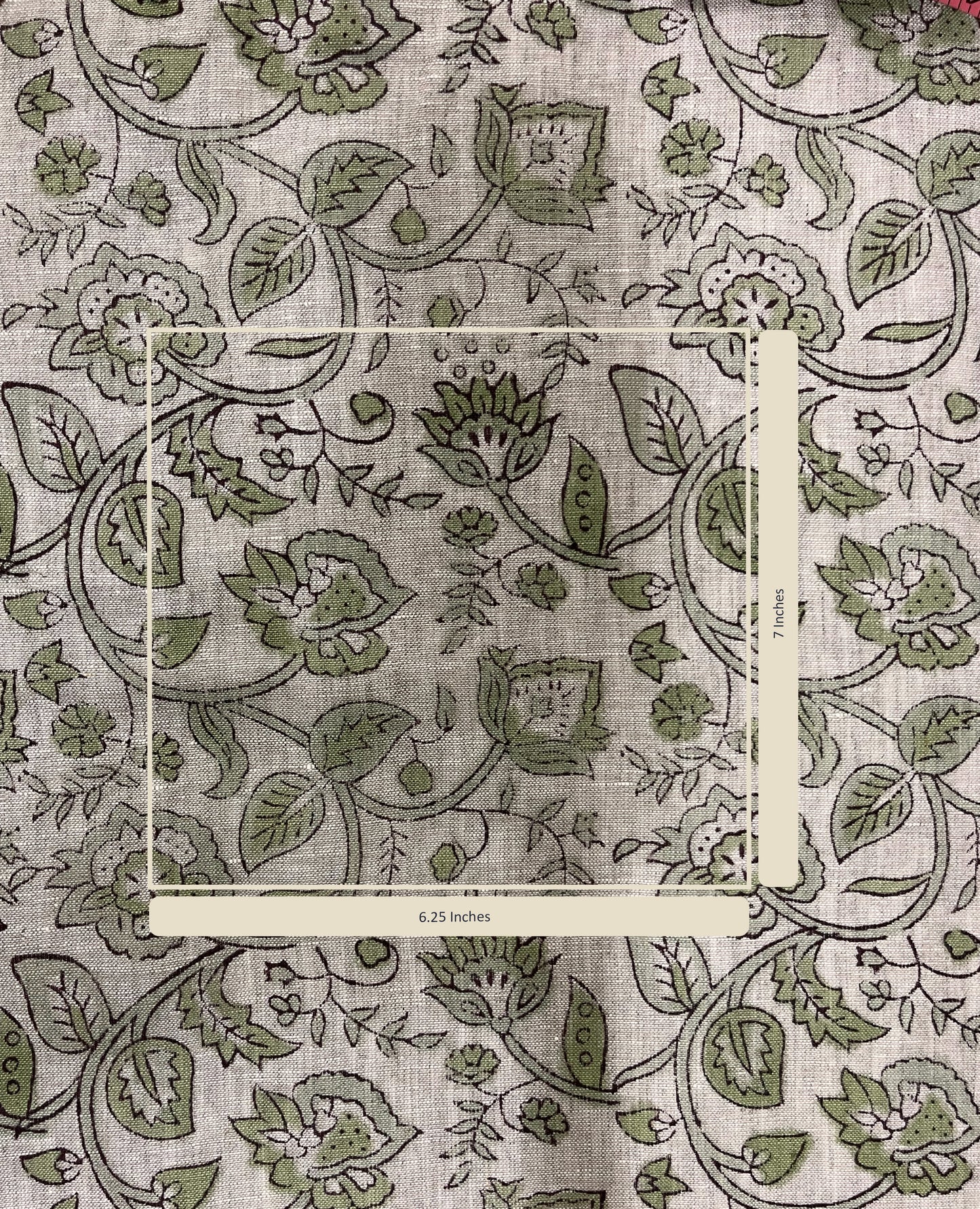 Floral and leaf patterned fabric with a measurement label