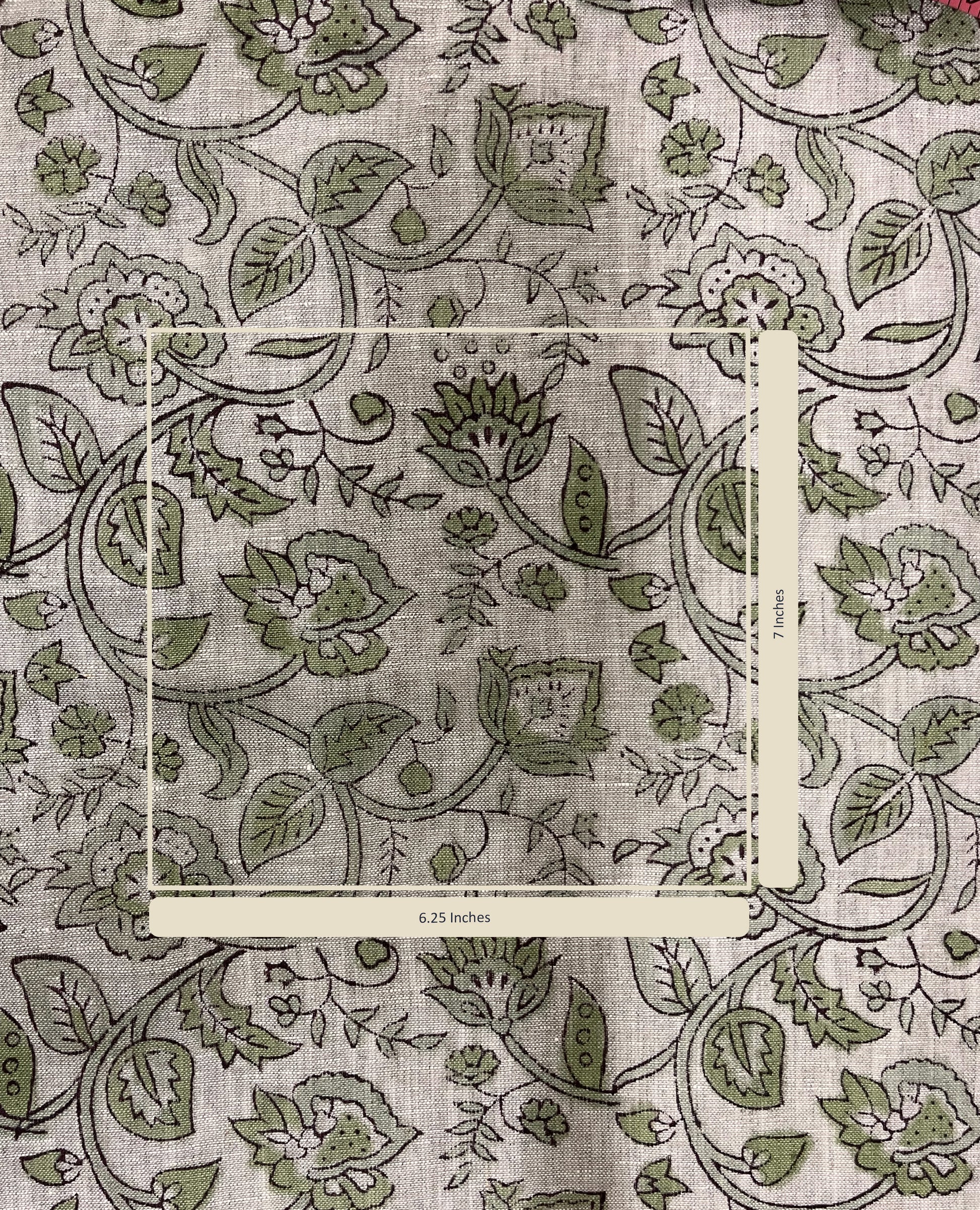 Floral and leaf patterned fabric with a measurement label