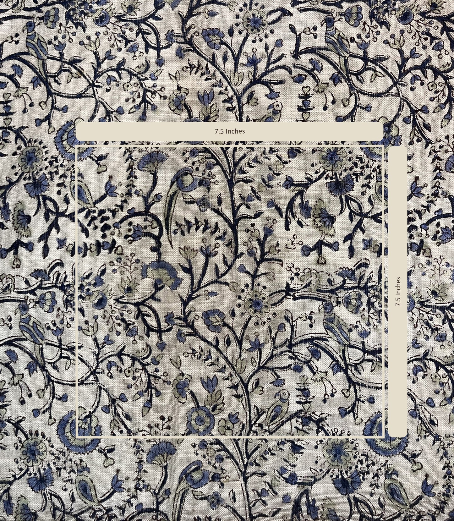 Patterned fabric with blue floral and bird design on a white background