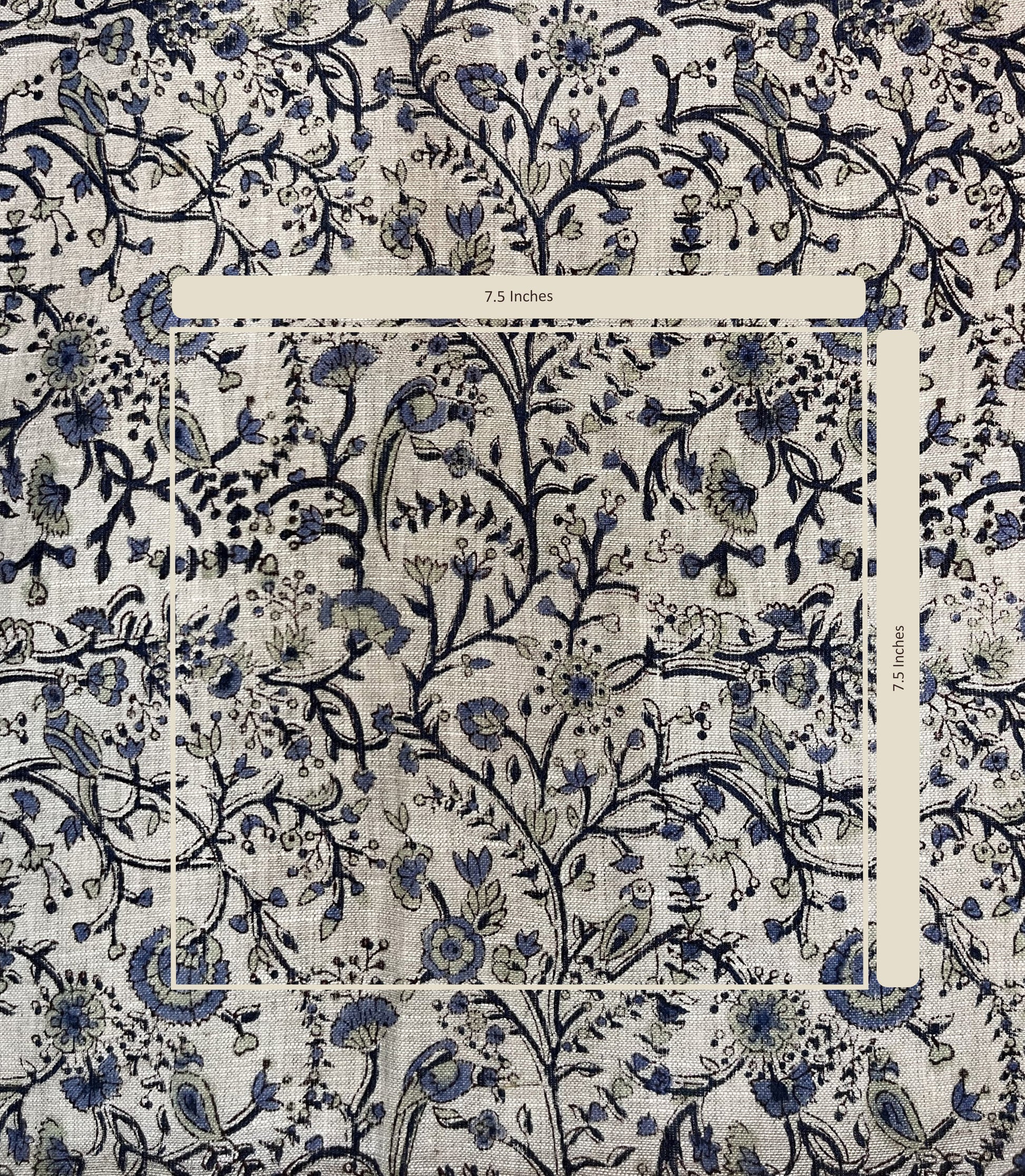 Patterned fabric with blue floral and bird design on a white background