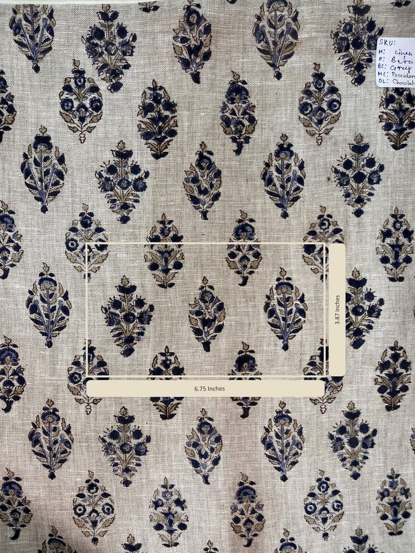 Fabric with blue floral pattern on a grey background