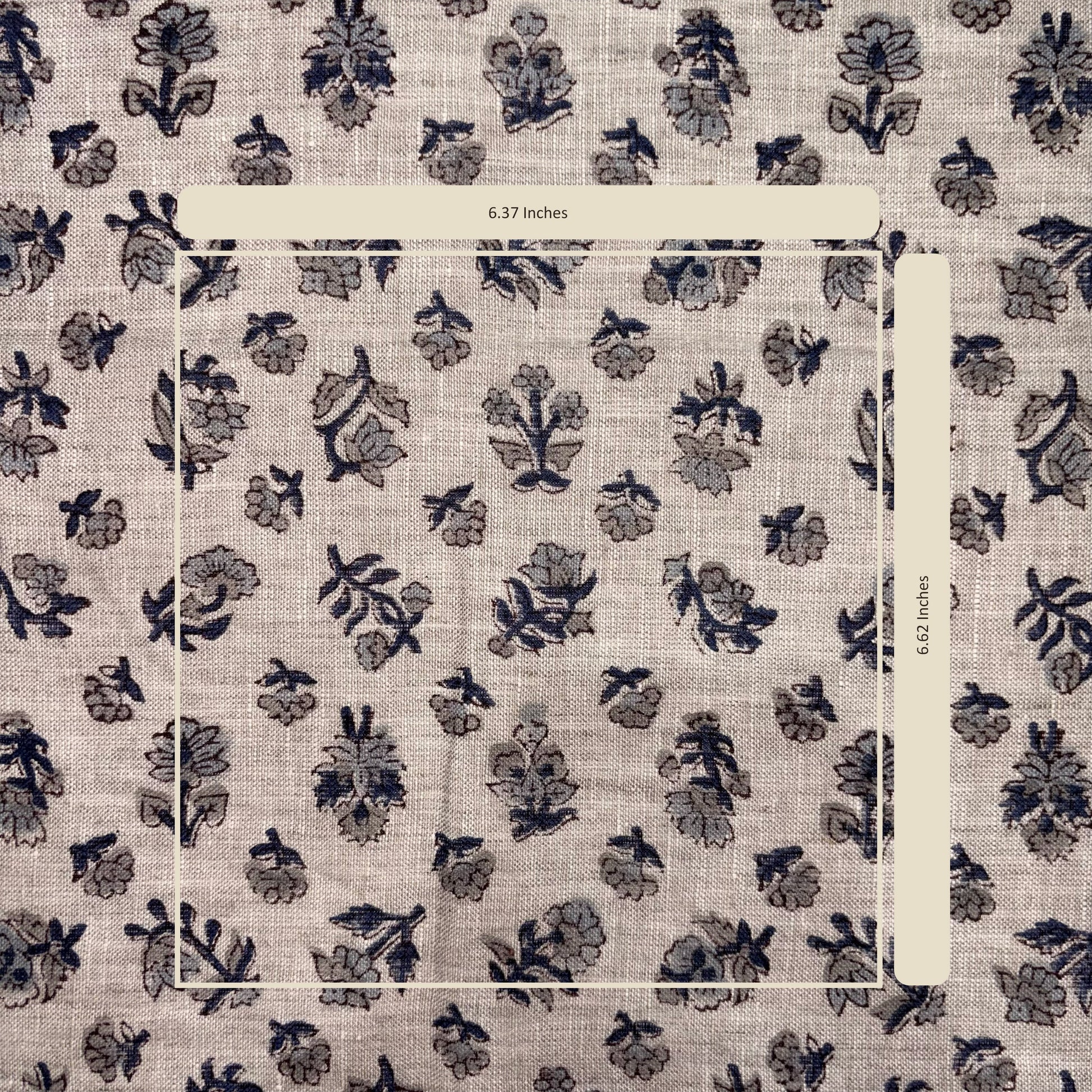 Floral patterned fabric with a ruler for scale on a beige background