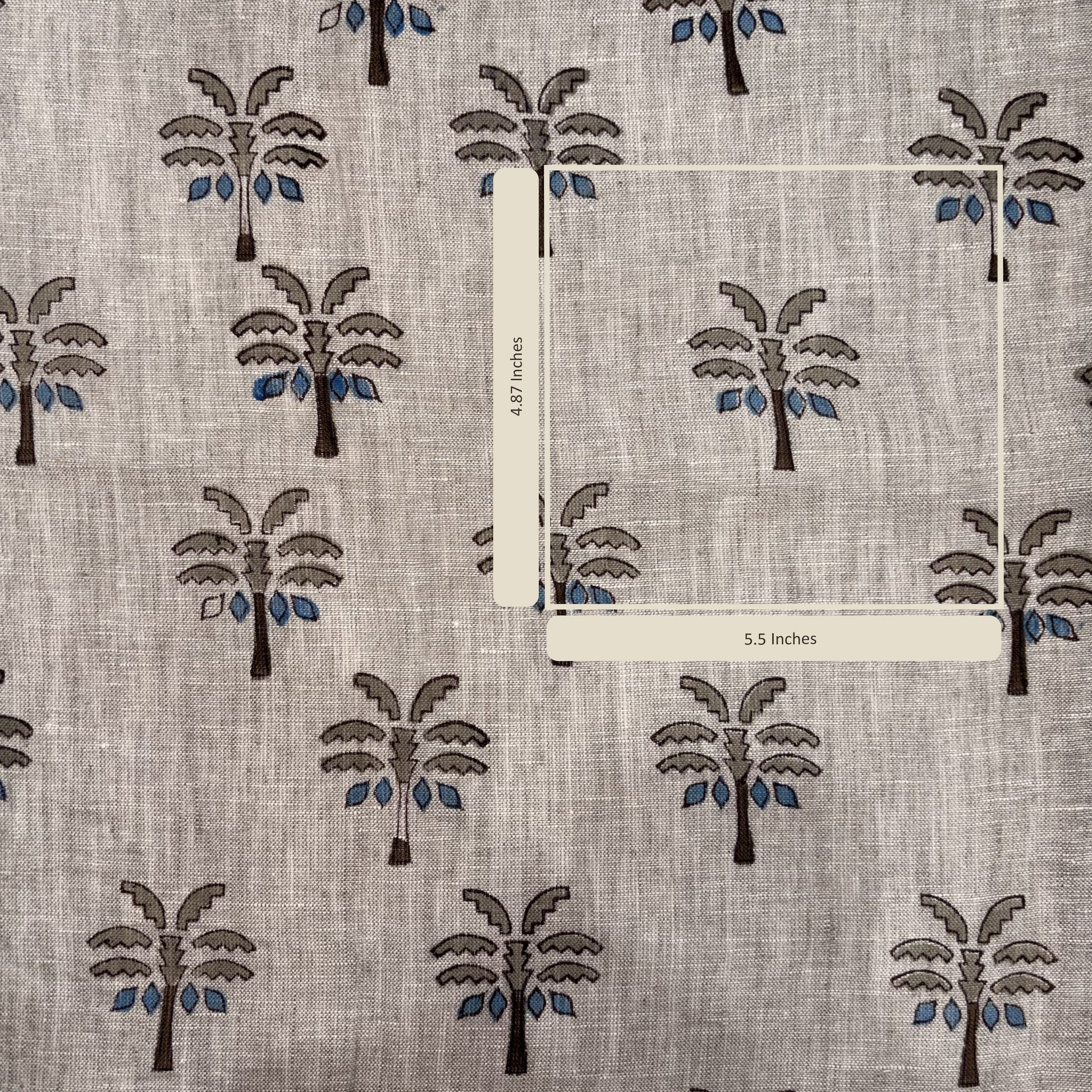 Fabric with palm tree pattern and measurement labels on a gray background