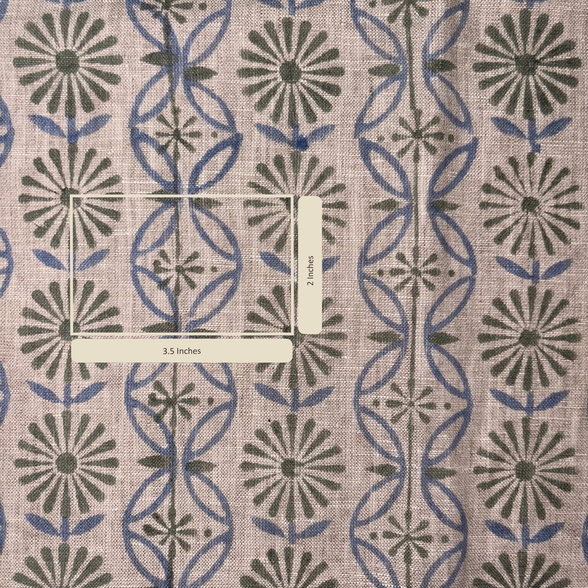Fabric with a geometric pattern featuring blue and green shapes on a beige background.