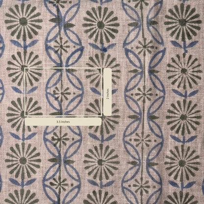 Fabric with a geometric pattern featuring blue and green shapes on a beige background.