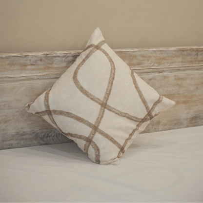 Decorative pillow with brown abstract pattern on a neutral background
