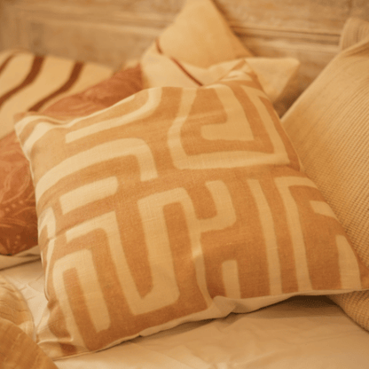 Patterned pillow on a beige sofa