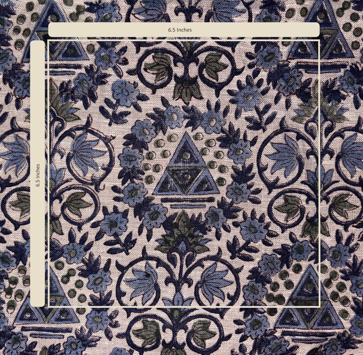 Patterned fabric with blue and green design, featuring triangles and floral elements.